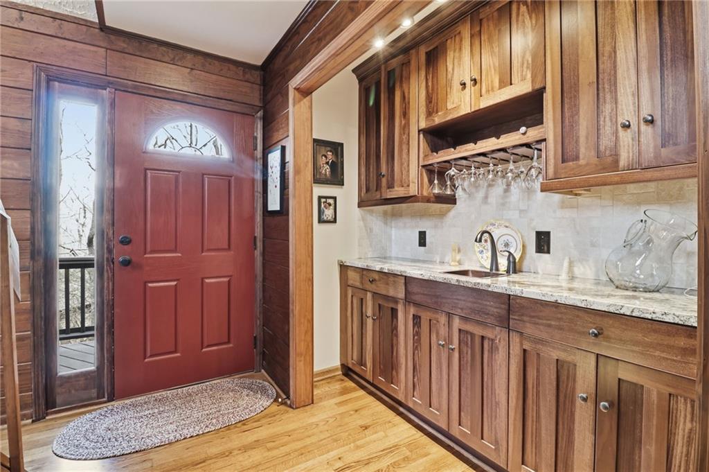 115 Chestnut Oak Point Big Canoe, GA 30143 - Photo 22 of 56 a kitchen with stainless steel appliances granite countertop a stove and cabinets