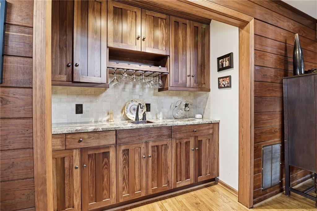 115 Chestnut Oak Point Big Canoe, GA 30143 - Photo 23 of 56 a kitchen with stainless steel appliances granite countertop a sink and cabinets