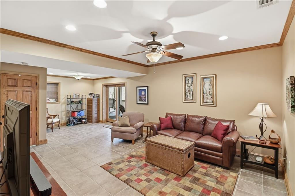 115 Chestnut Oak Point Big Canoe, GA 30143 - Photo 25 of 56 a living room with furniture and a fireplace