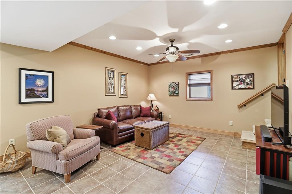 115 Chestnut Oak Point Big Canoe, GA 30143 - Photo 30 of 56 a living room with furniture and a flat screen tv
