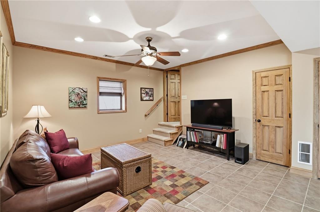 115 Chestnut Oak Point Big Canoe, GA 30143 - Photo 31 of 56 a living room with furniture and a flat screen tv