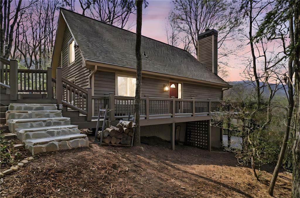 115 Chestnut Oak Point Big Canoe, GA 30143 - Photo 40 of 56 a view of house with deck and outdoor seating