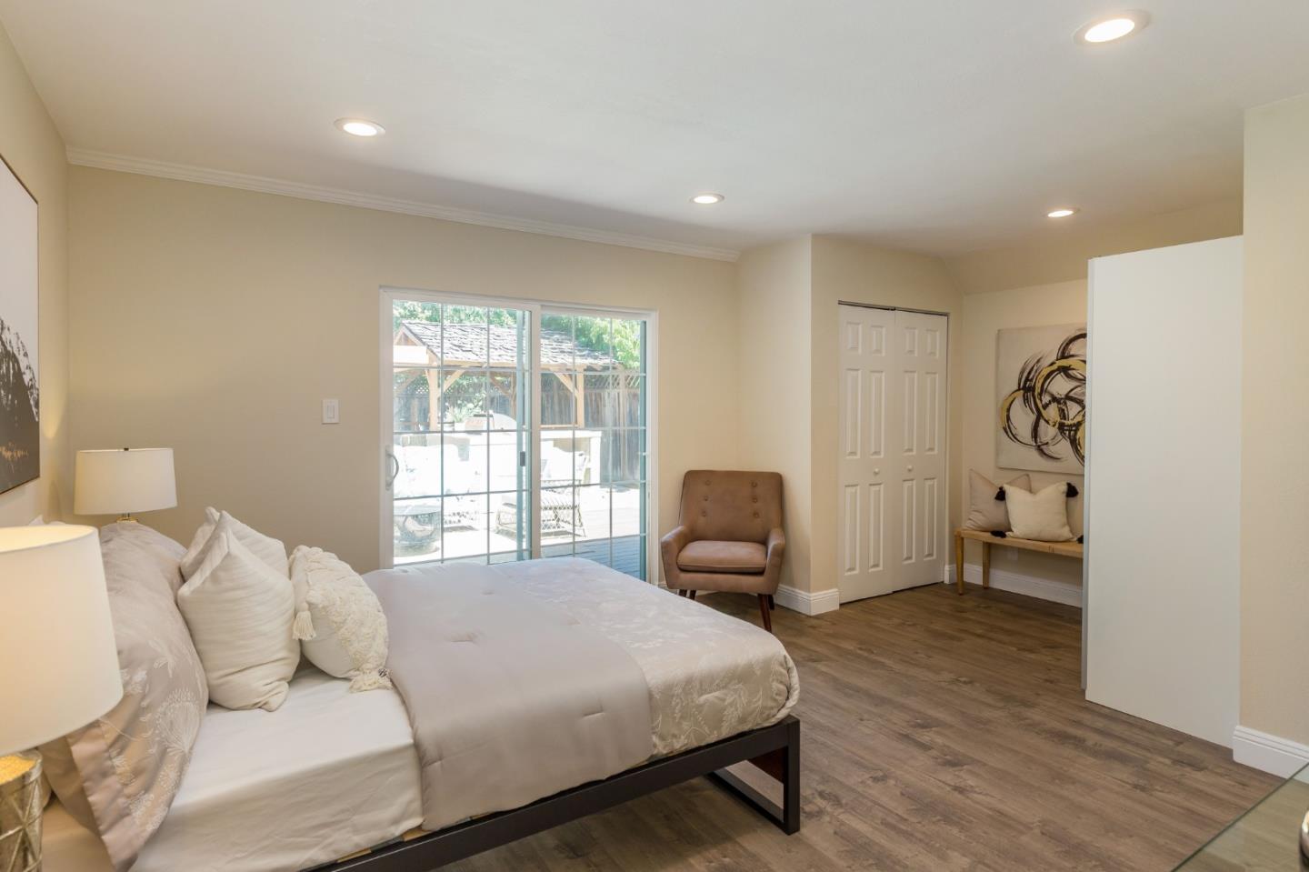 552 Marsh Road Menlo Park, CA 94025 - Photo 12 of 22 a bedroom with a bed and wooden floor