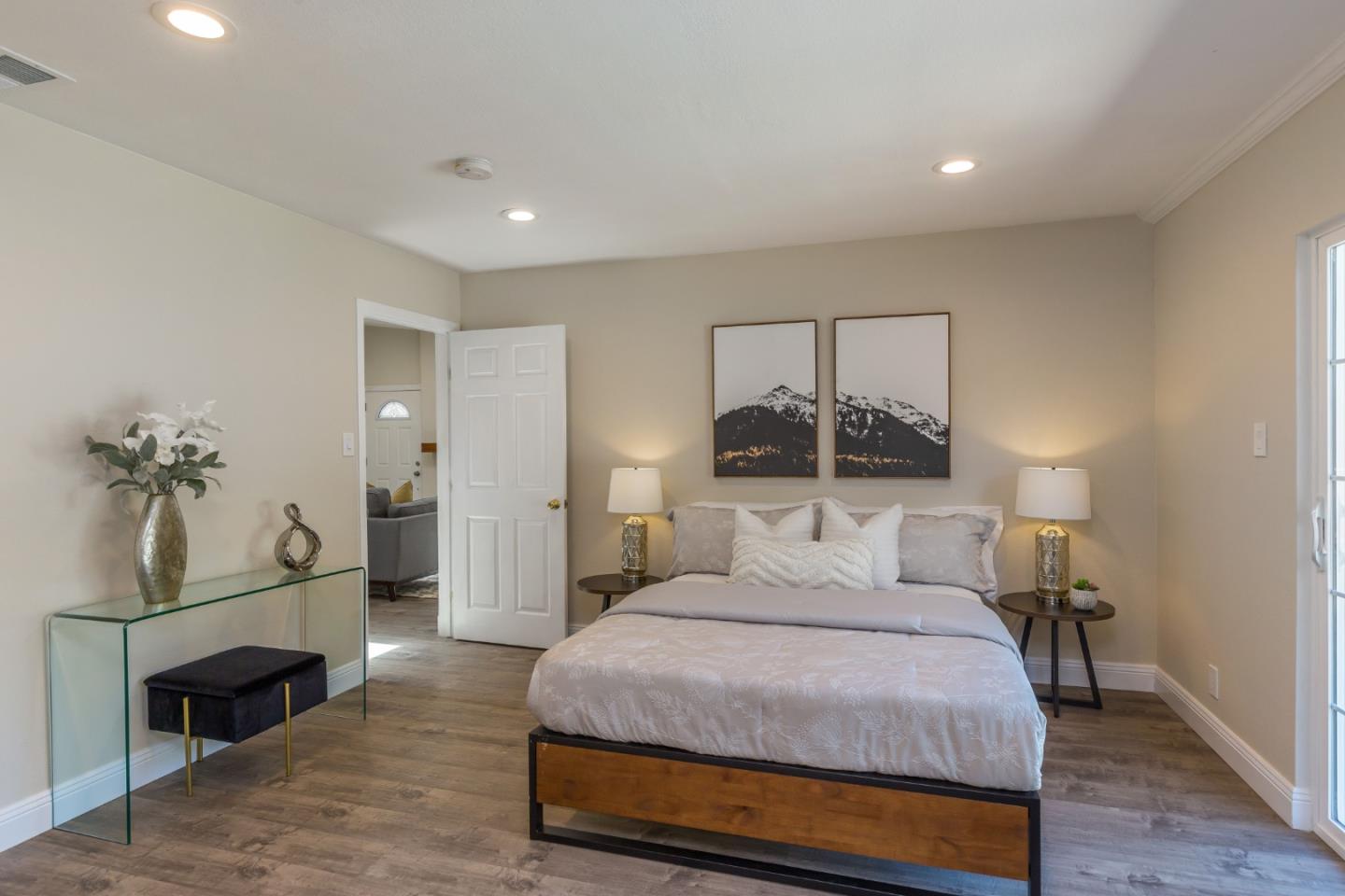 552 Marsh Road Menlo Park, CA 94025 - Photo 14 of 22 a bedroom with a large bed and a chandelier