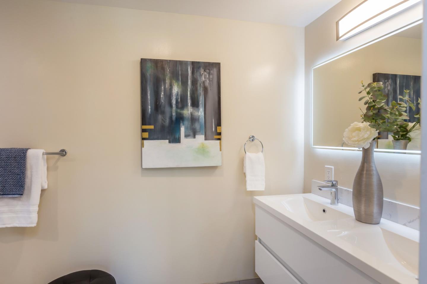 552 Marsh Road Menlo Park, CA 94025 - Photo 17 of 22 a bathroom with a sink and a mirror