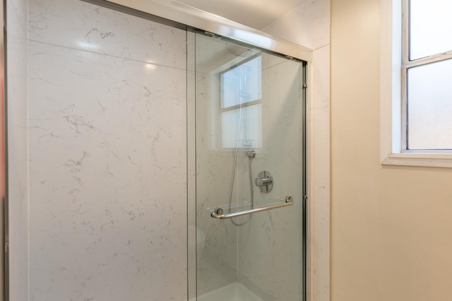 552 Marsh Road Menlo Park, CA 94025 - Photo 18 of 22 a bathroom with a glass shower door