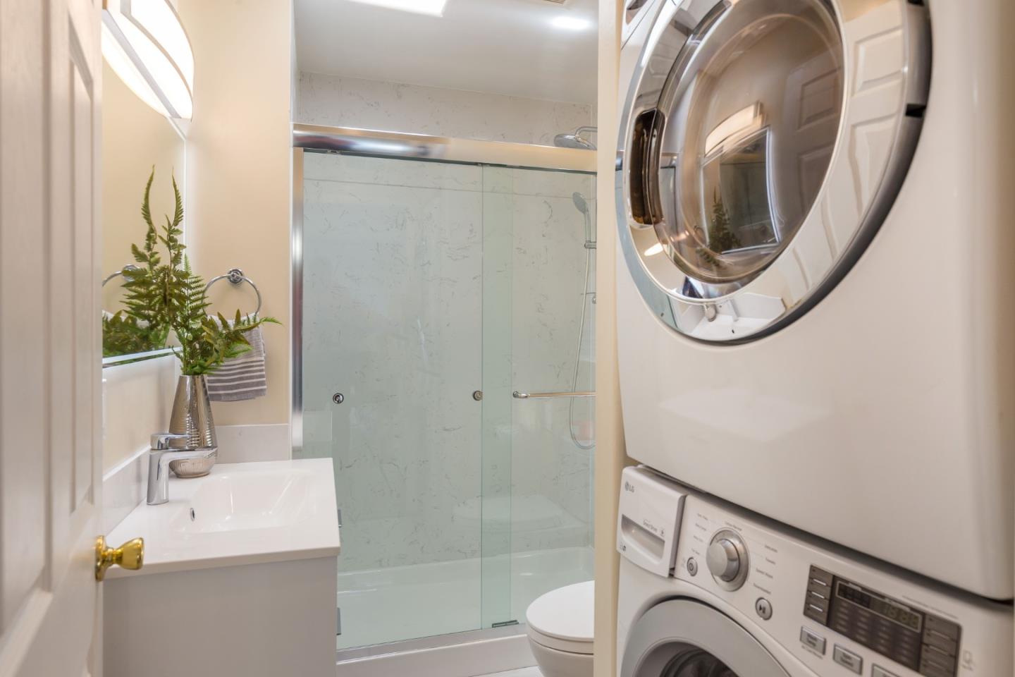 552 Marsh Road Menlo Park, CA 94025 - Photo 19 of 22 a bathroom with a sink a toilet and a mirror