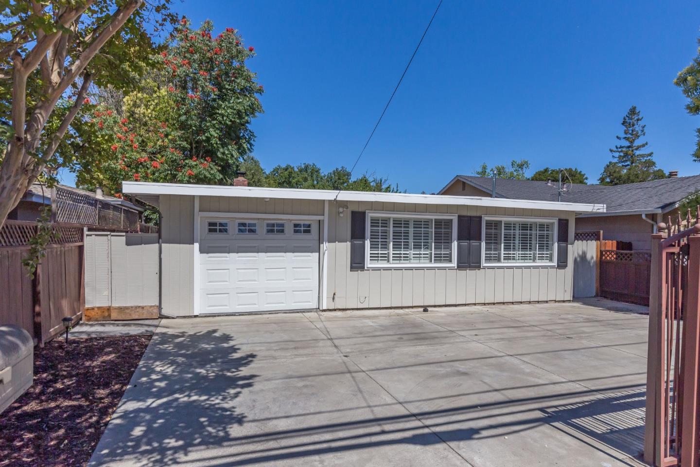 552 Marsh Road Menlo Park, CA 94025 - Photo 2 of 22 a front view of a house with a garden