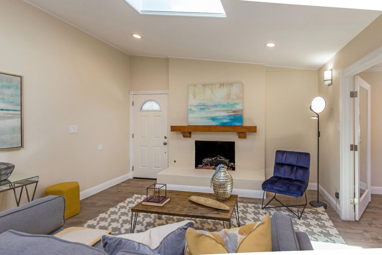 552 Marsh Road Menlo Park, CA 94025 - Photo 8 of 22 a living room with furniture and a fireplace