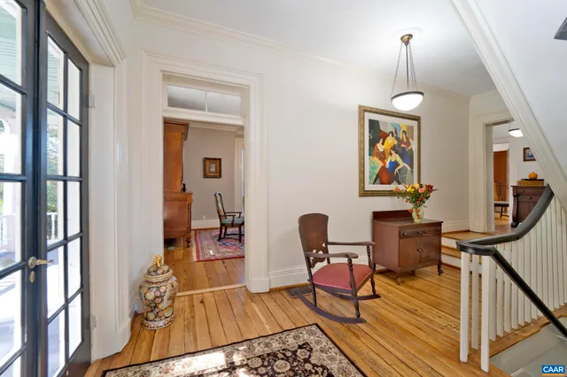 a kitchen that has a lot of cabinets and wooden floor