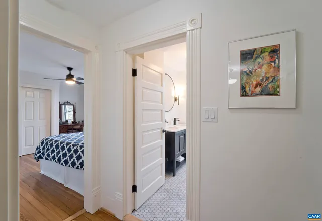 an aerial view of a house with garden space and a street view