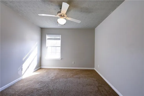 an empty room that has a window