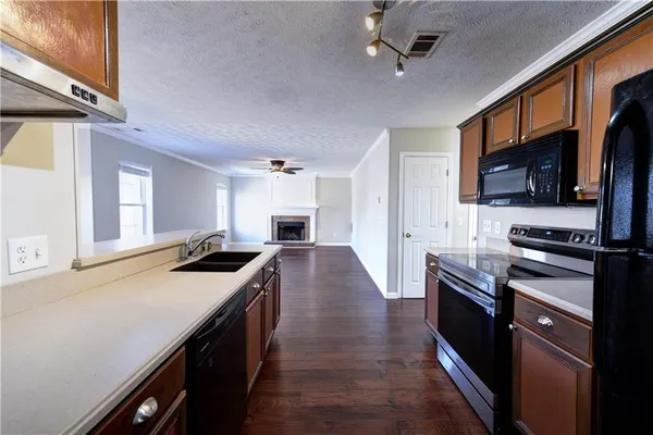 a kitchen with a stove and a sink