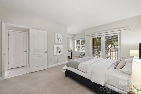 a bedroom with a bed and a couch