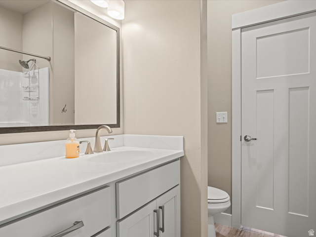 608 Fremont Road Fish Haven, ID 83287 - Photo 22 of 35 Bathroom vanity with white countertop, undermount sink, and brushed nickel fixtures