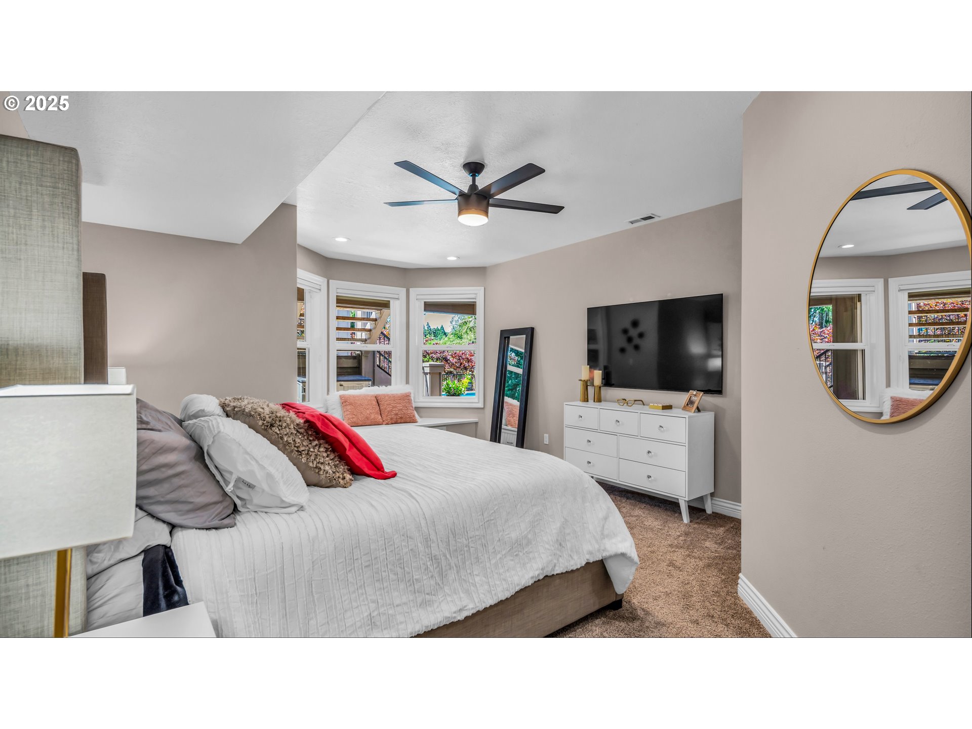 4075 Northwest Camala Drive Albany, OR 97321 - Photo 35 of 48 a living room with a bed furniture a flat screen tv and kitchen view