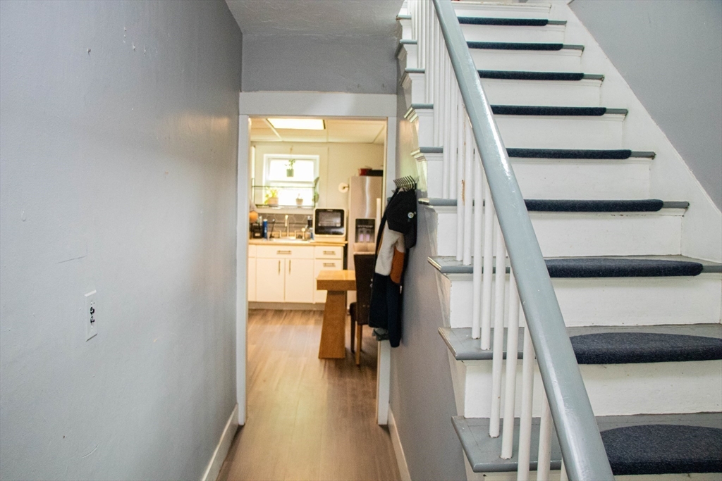 85-87 Slater Street Webster, MA 01570 - Photo 12 of 41 a view of entryway and hall with wooden floor