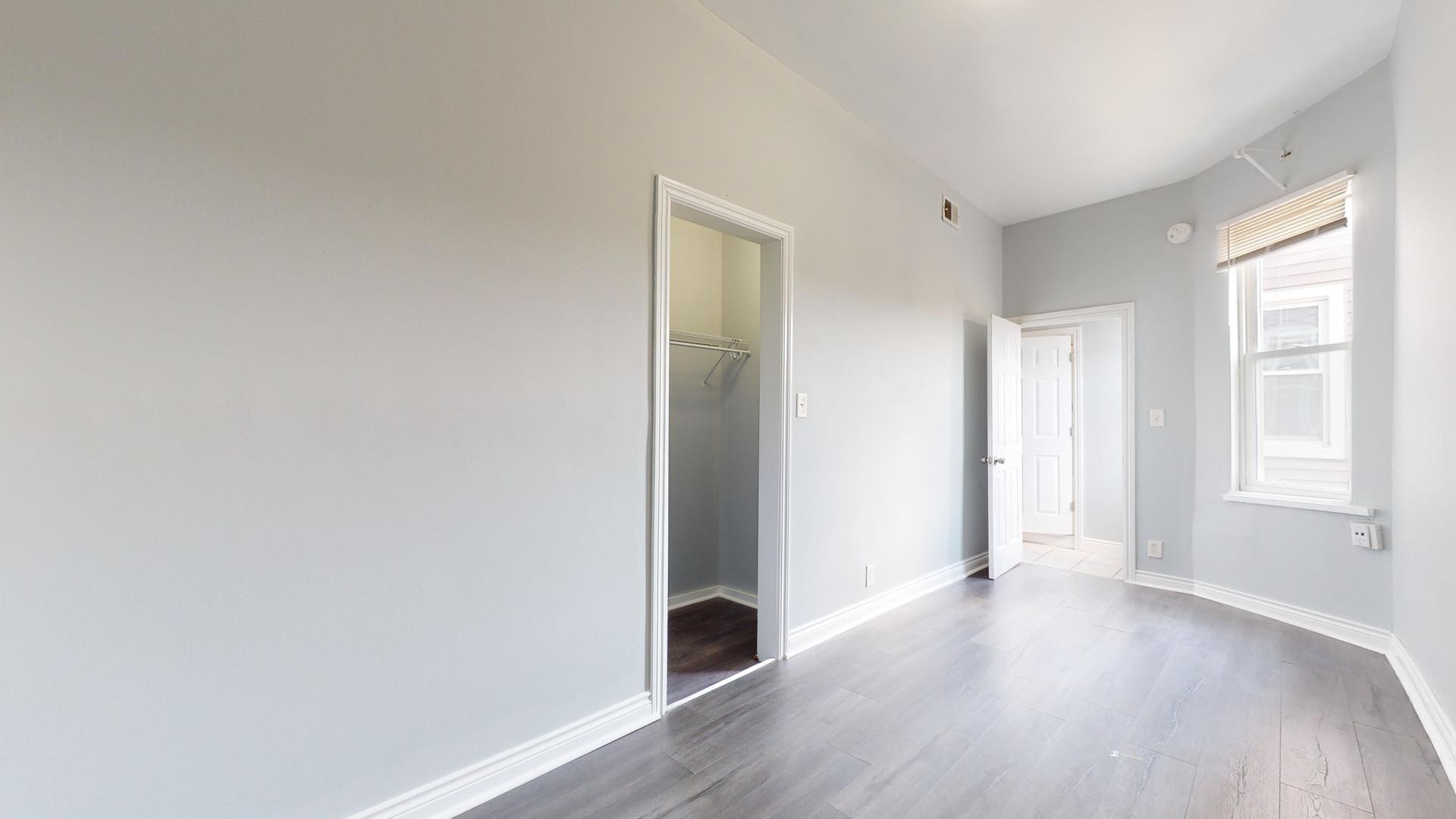 2700 West Cermak Road, Unit 2F Chicago, IL 60608 - Photo 11 of 16 a view of a big room with wooden floor and windows