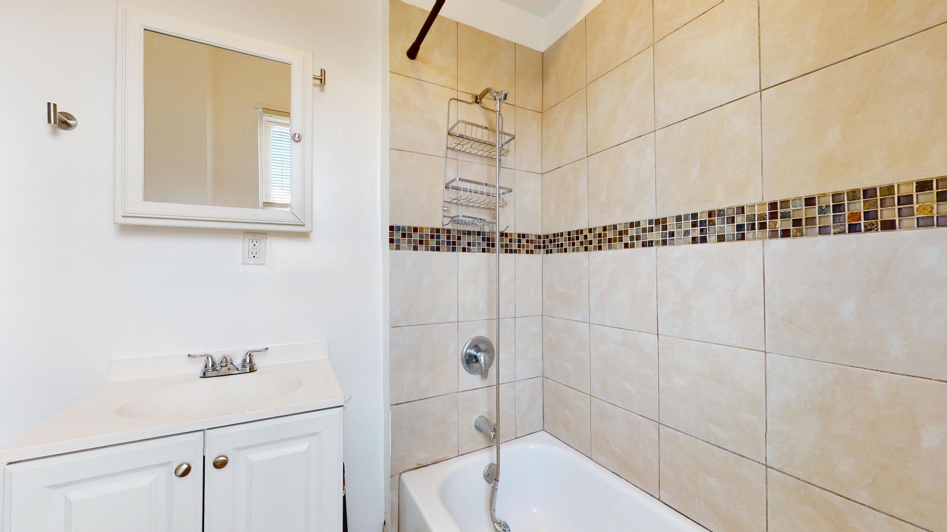 2700 West Cermak Road, Unit 2F Chicago, IL 60608 - Photo 13 of 16 a bathroom with a shower