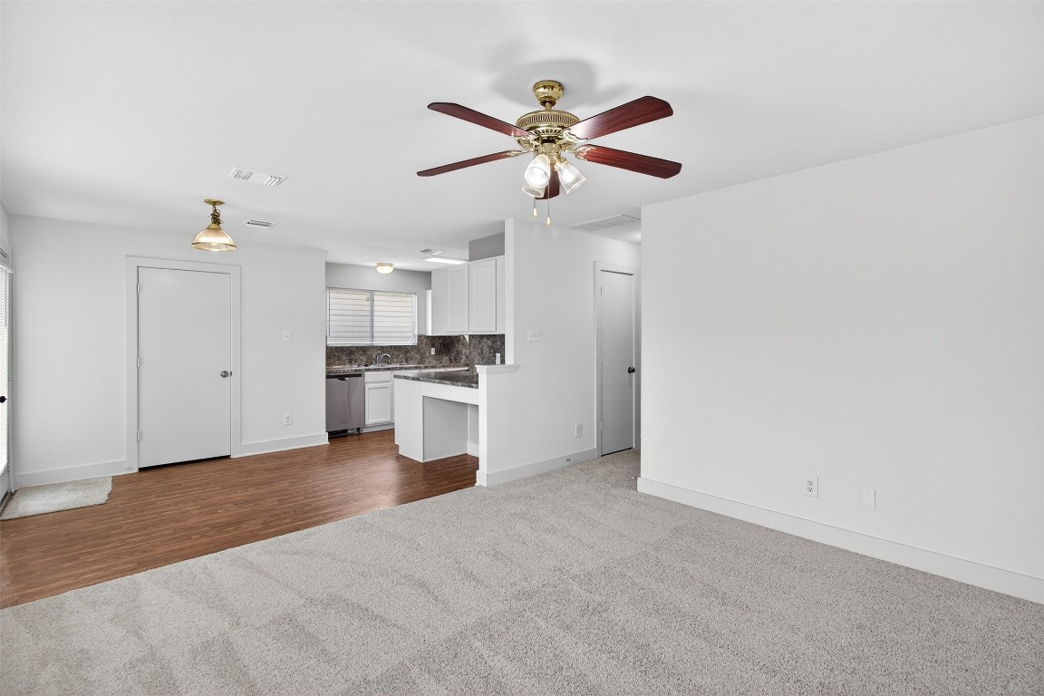 803 Dragonfly Drive Conroe, TX 77301 - Photo 15 of 50 a view of an empty room with kitchen and a window