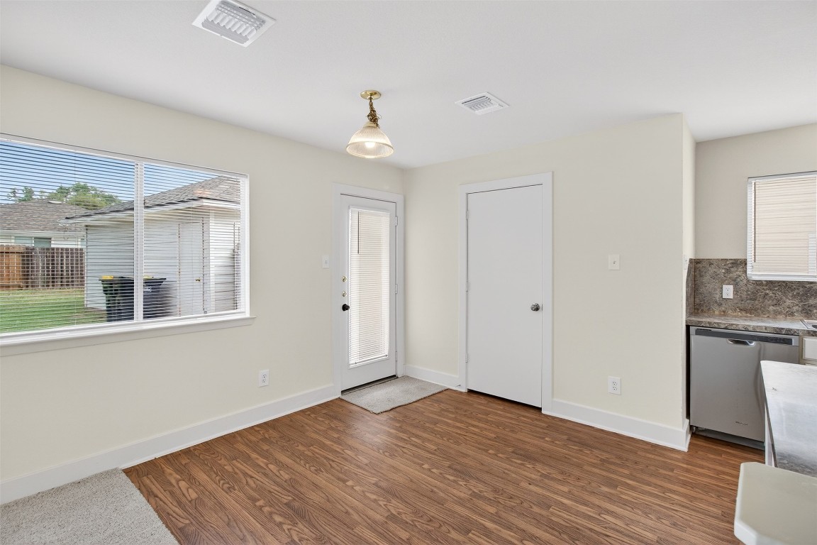 803 Dragonfly Drive Conroe, TX 77301 - Photo 18 of 50 an empty room with wooden floor and windows