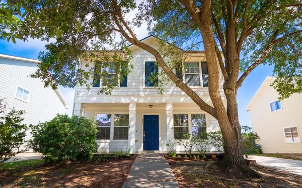 front view of a house with a trees