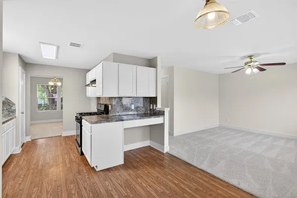 a kitchen with a sink and cabinets