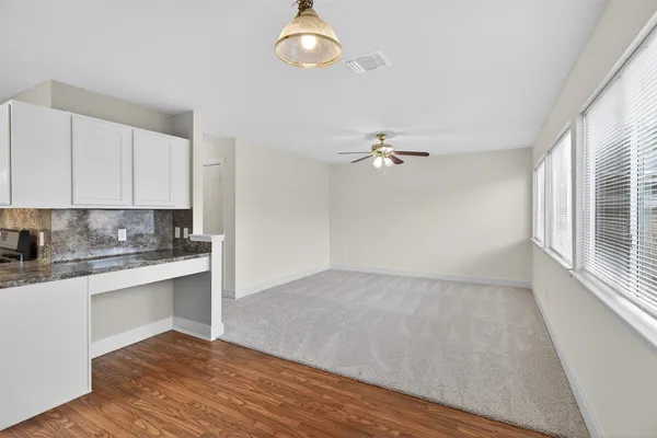 a view of a kitchen with electric appliances