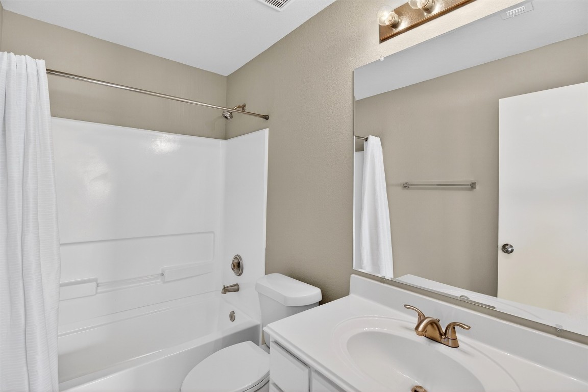 803 Dragonfly Drive Conroe, TX 77301 - Photo 32 of 50 a bathroom with a sink toilet and shower