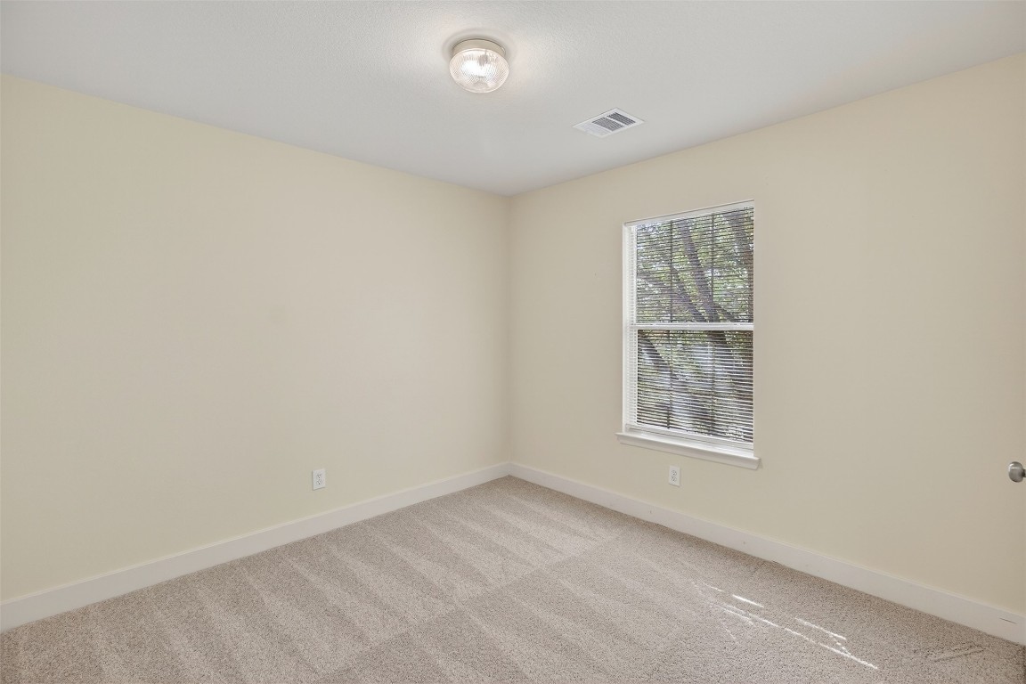 803 Dragonfly Drive Conroe, TX 77301 - Photo 36 of 50 an empty room with windows