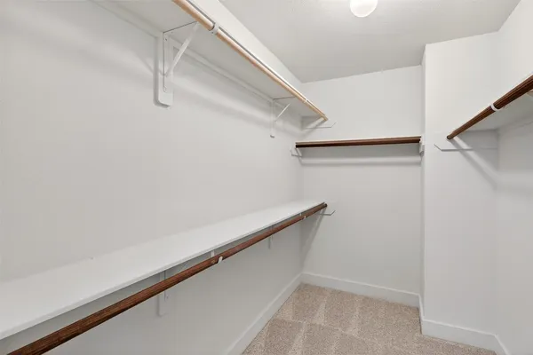 a bathroom with a sink double vanity and a mirror