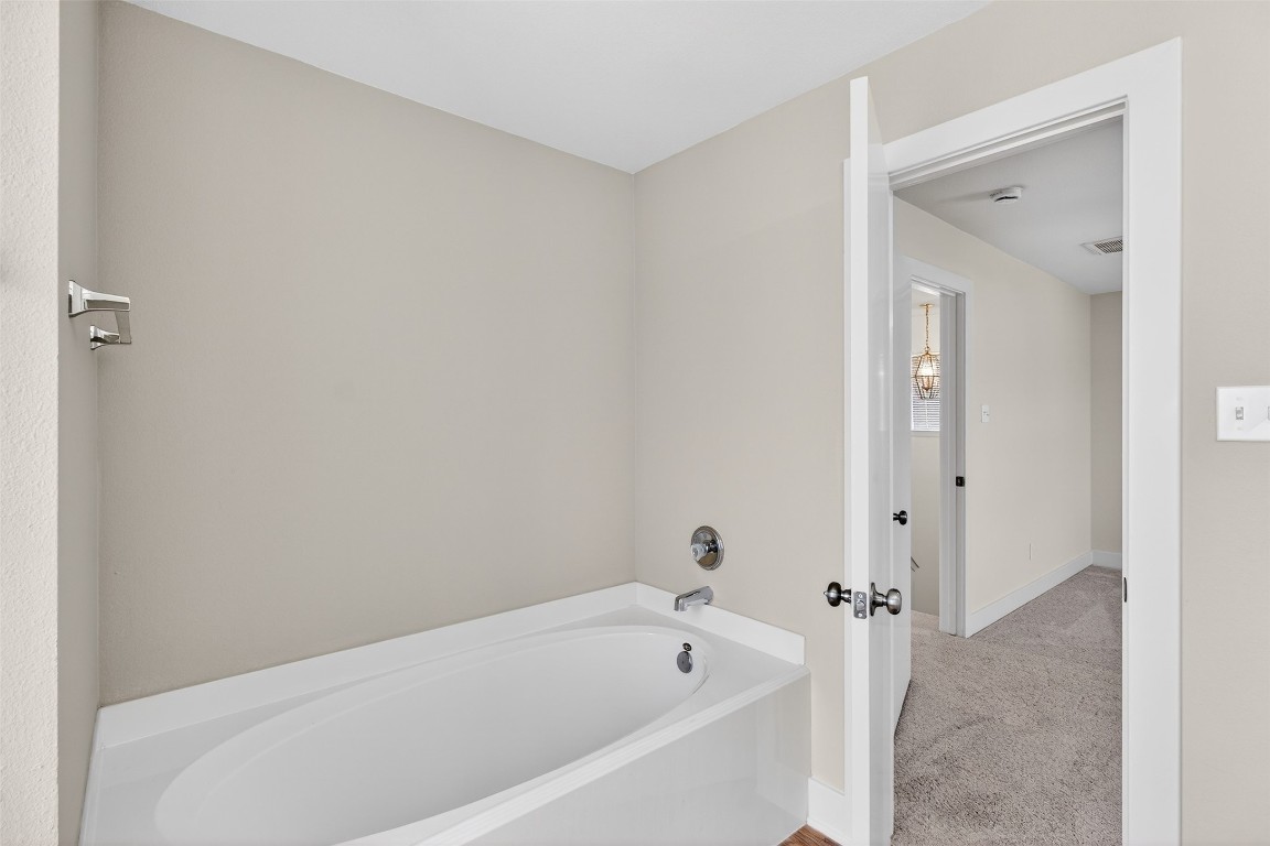 803 Dragonfly Drive Conroe, TX 77301 - Photo 44 of 50 a bathroom with a bathtub