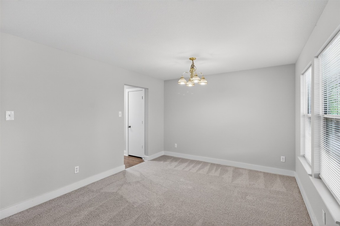 803 Dragonfly Drive Conroe, TX 77301 - Photo 5 of 50 wooden floor in an empty room with a window