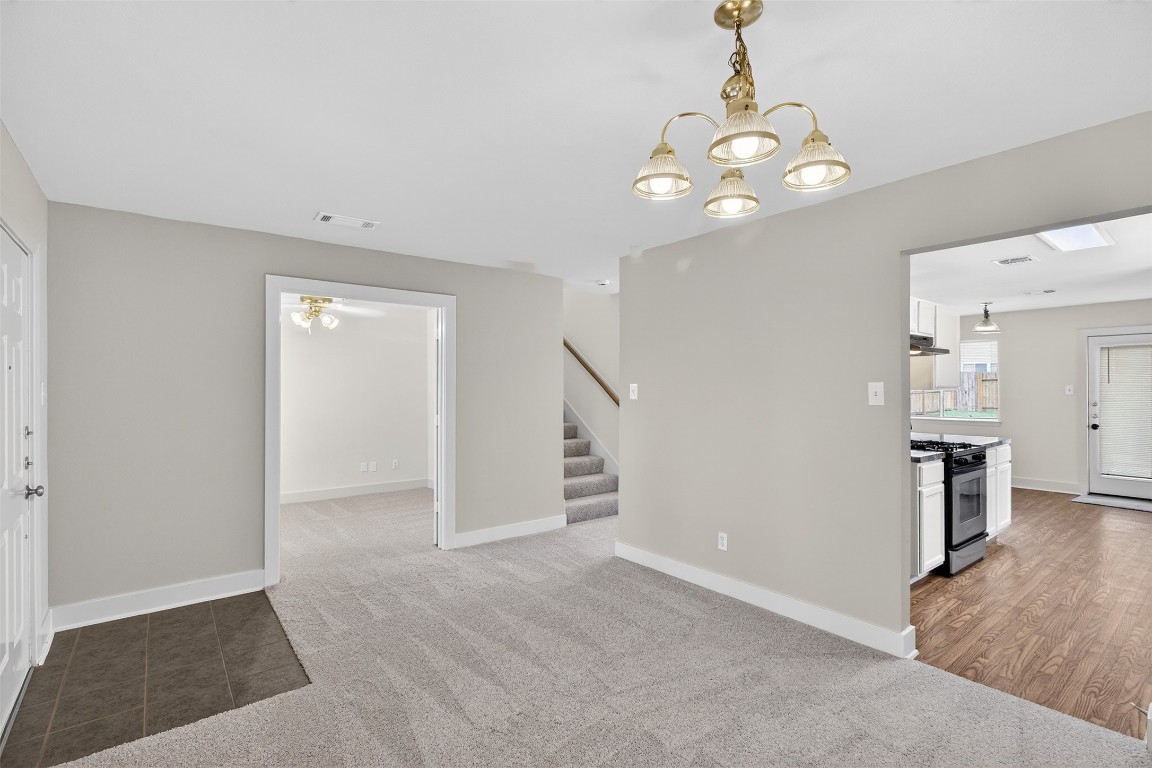 803 Dragonfly Drive Conroe, TX 77301 - Photo 6 of 50 wooden floor in an empty room with a window