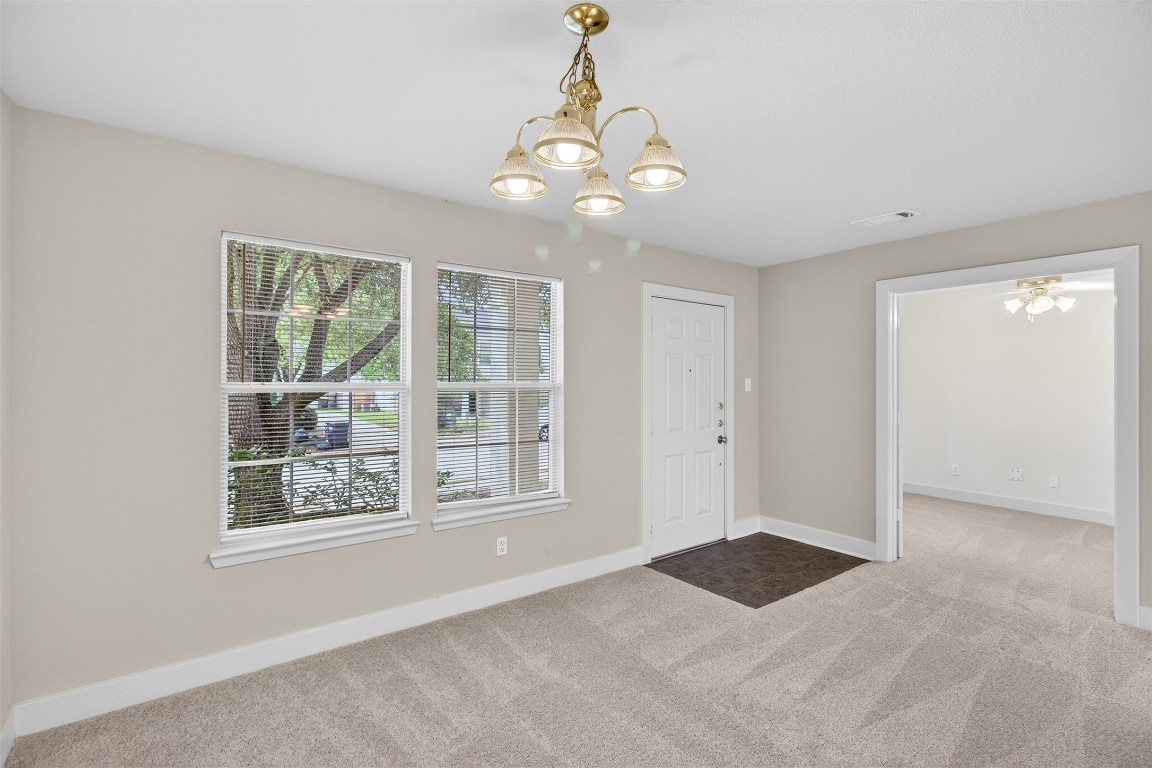 803 Dragonfly Drive Conroe, TX 77301 - Photo 7 of 50 a view of an empty room with a window