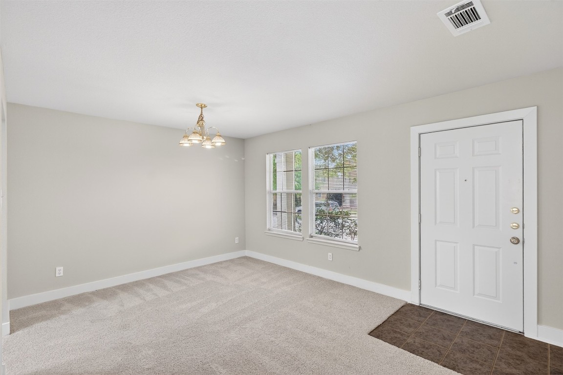 803 Dragonfly Drive Conroe, TX 77301 - Photo 8 of 50 an empty room with windows and closet