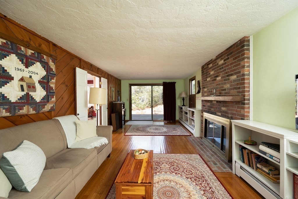 32 Old County Road Hingham, MA 02043 - Photo 17 of 38 a hallway with a couch and a stove top oven