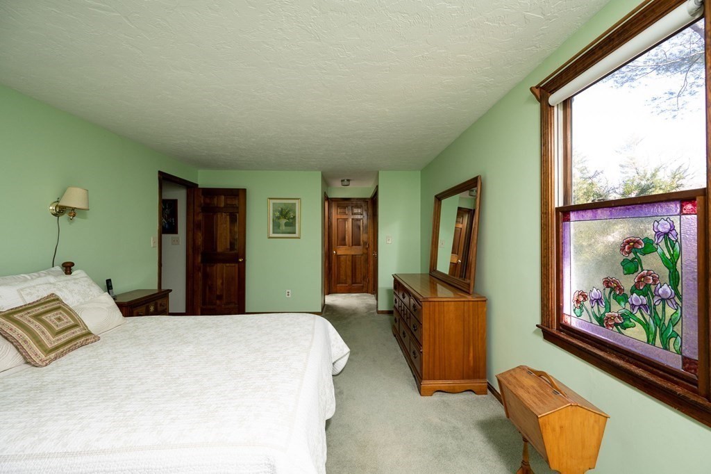 32 Old County Road Hingham, MA 02043 - Photo 21 of 38 a bedroom with a bed and large windows