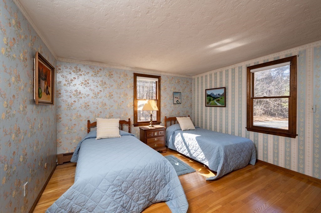 32 Old County Road Hingham, MA 02043 - Photo 23 of 38 a bedroom with two beds and a window
