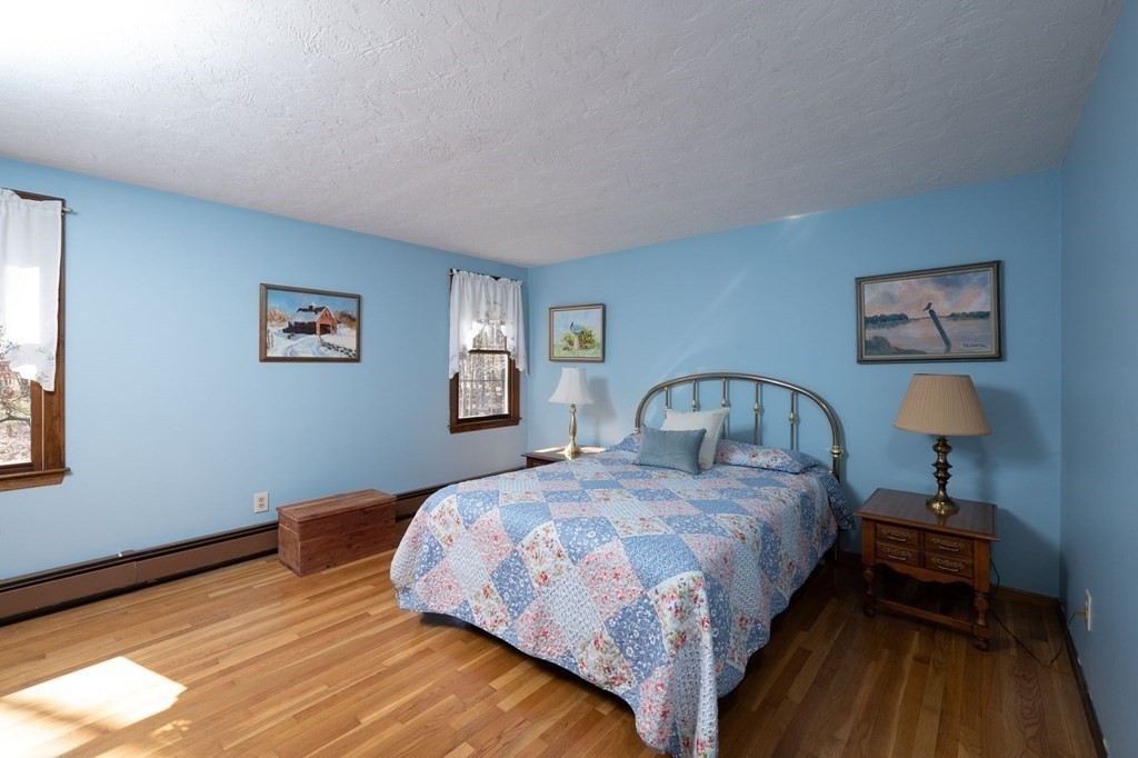 32 Old County Road Hingham, MA 02043 - Photo 24 of 38 a bedroom with a bed and a night stand
