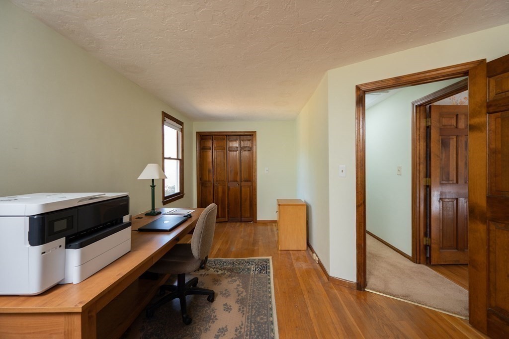 32 Old County Road Hingham, MA 02043 - Photo 25 of 38 a view of a workspace with furniture and a window