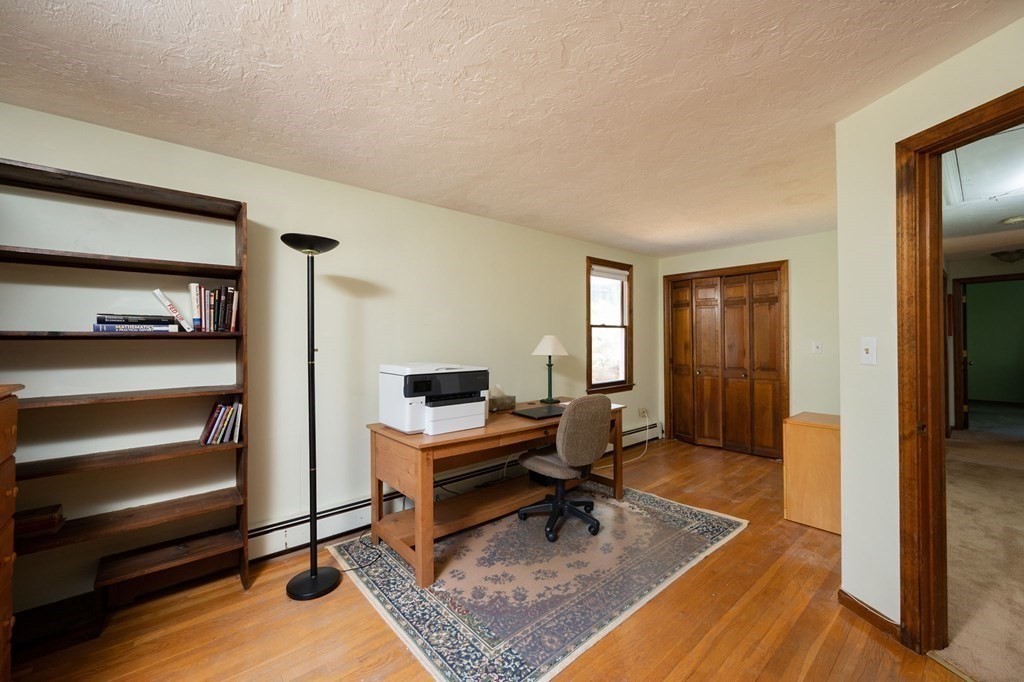 32 Old County Road Hingham, MA 02043 - Photo 26 of 38 a living room with furniture flat screen tv and a table