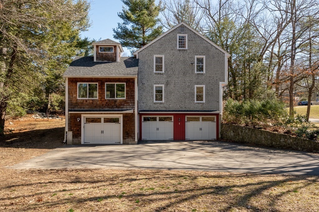 32 Old County Road Hingham, MA 02043 - Photo 28 of 38 a front view of a house with a garden
