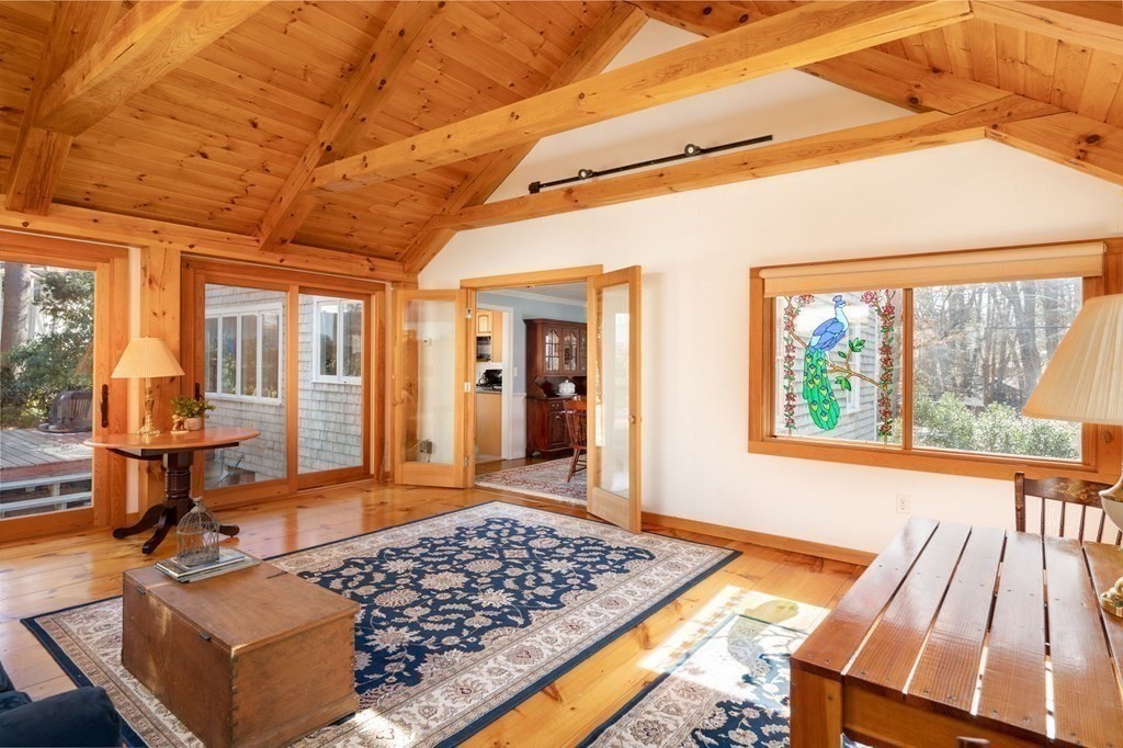 32 Old County Road Hingham, MA 02043 - Photo 3 of 38 a living room with lots of furniture and a open kitchen view