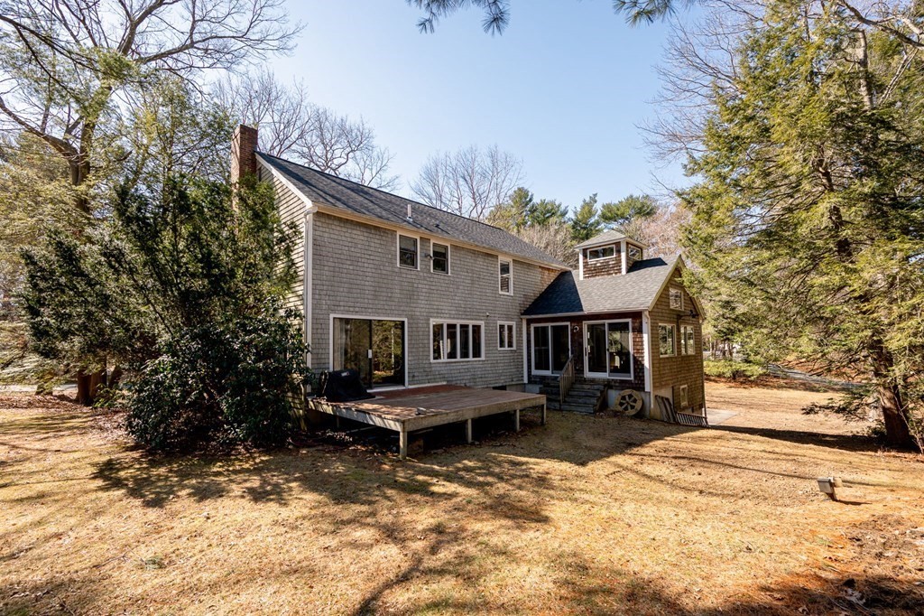 32 Old County Road Hingham, MA 02043 - Photo 32 of 38 a balcony with furniture and a yard