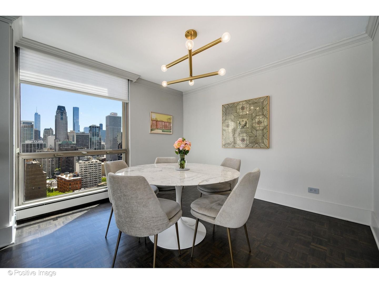 1310 North Ritchie Court, Unit 26C Chicago, IL 60610 - Photo 13 of 34 a view of a dining room with furniture and wooden floor