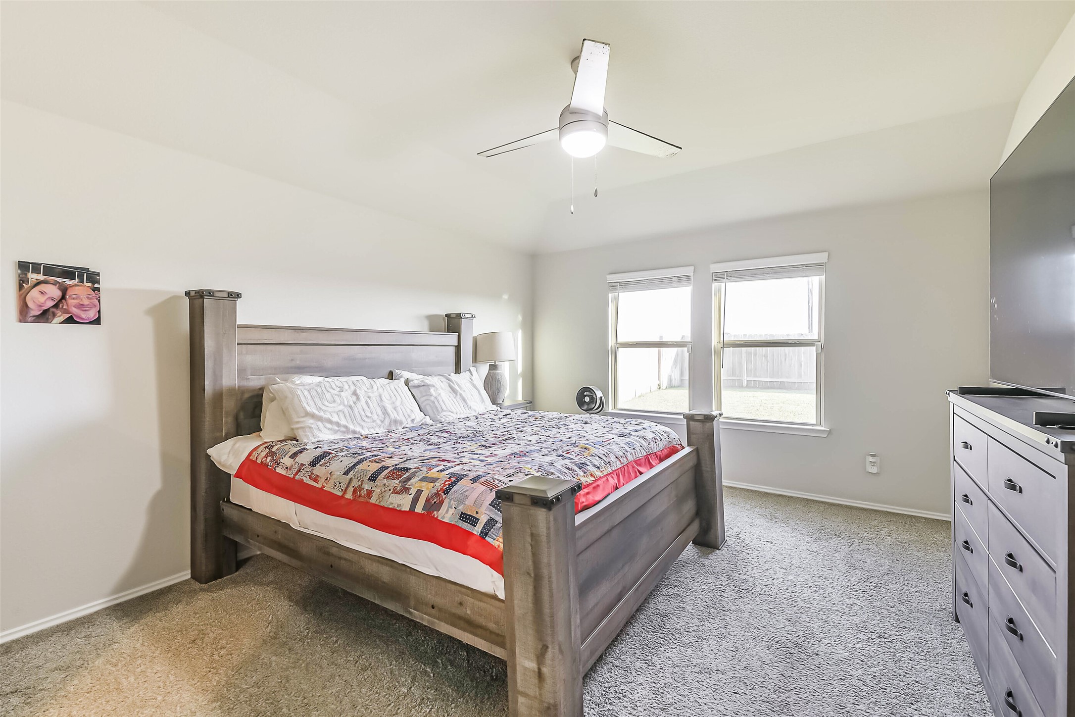 20342 Green Mountain Drive New Caney, TX 77357 - Photo 15 of 30 a bedroom with a bed and a window