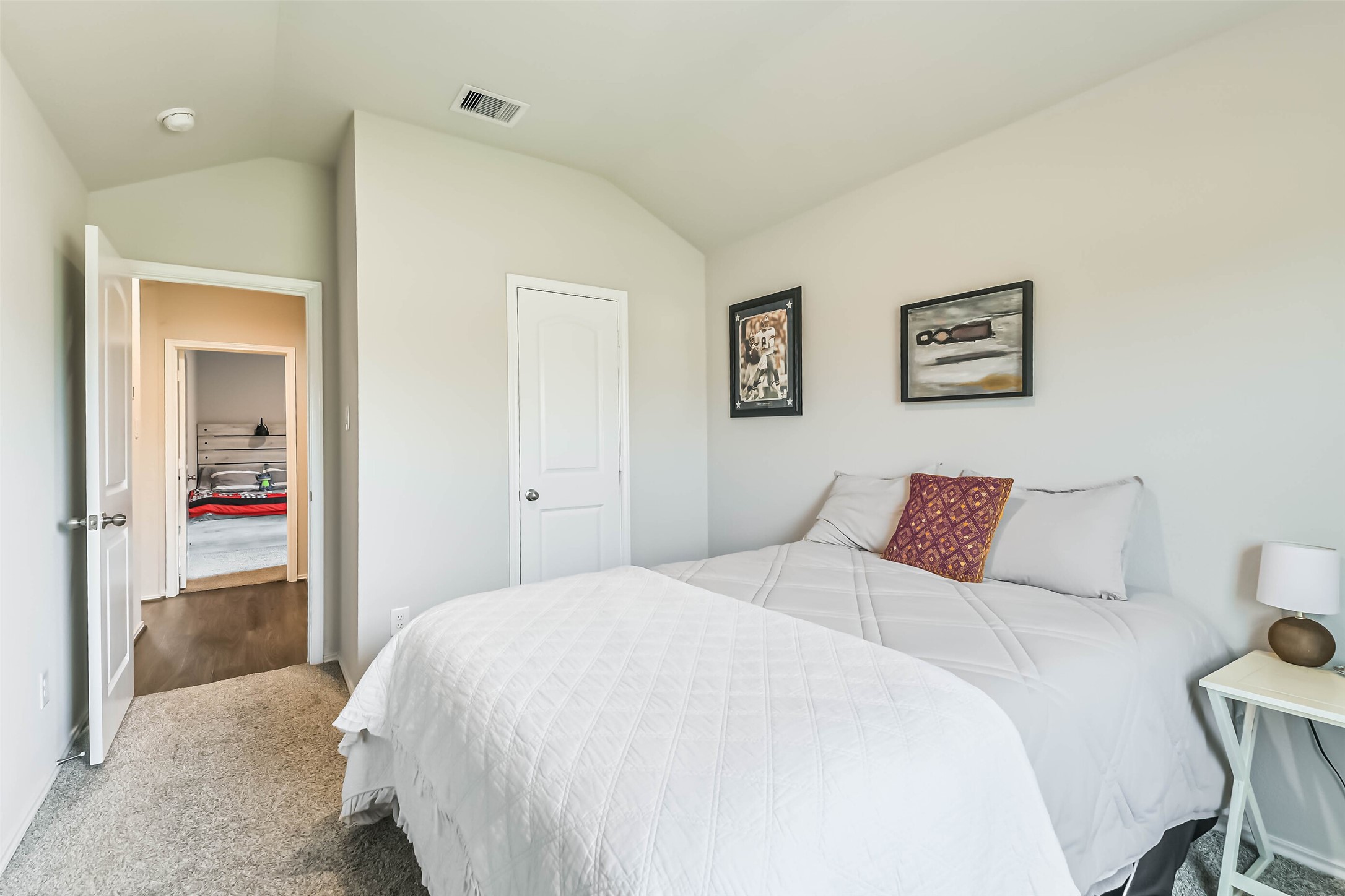 20342 Green Mountain Drive New Caney, TX 77357 - Photo 25 of 30 a bedroom with a bed and a painting on the wall