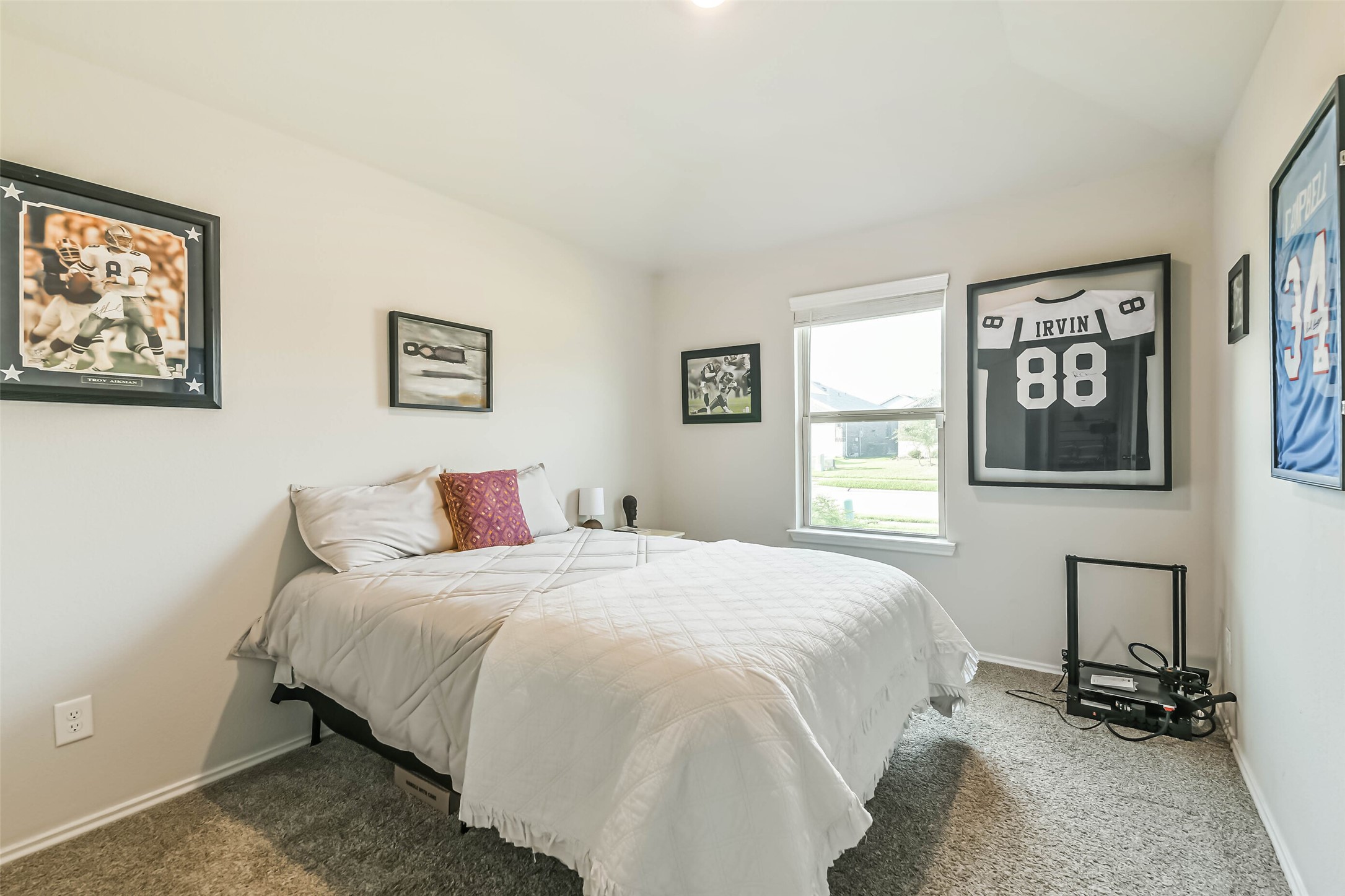 20342 Green Mountain Drive New Caney, TX 77357 - Photo 26 of 30 a bedroom with a bed and wall painting