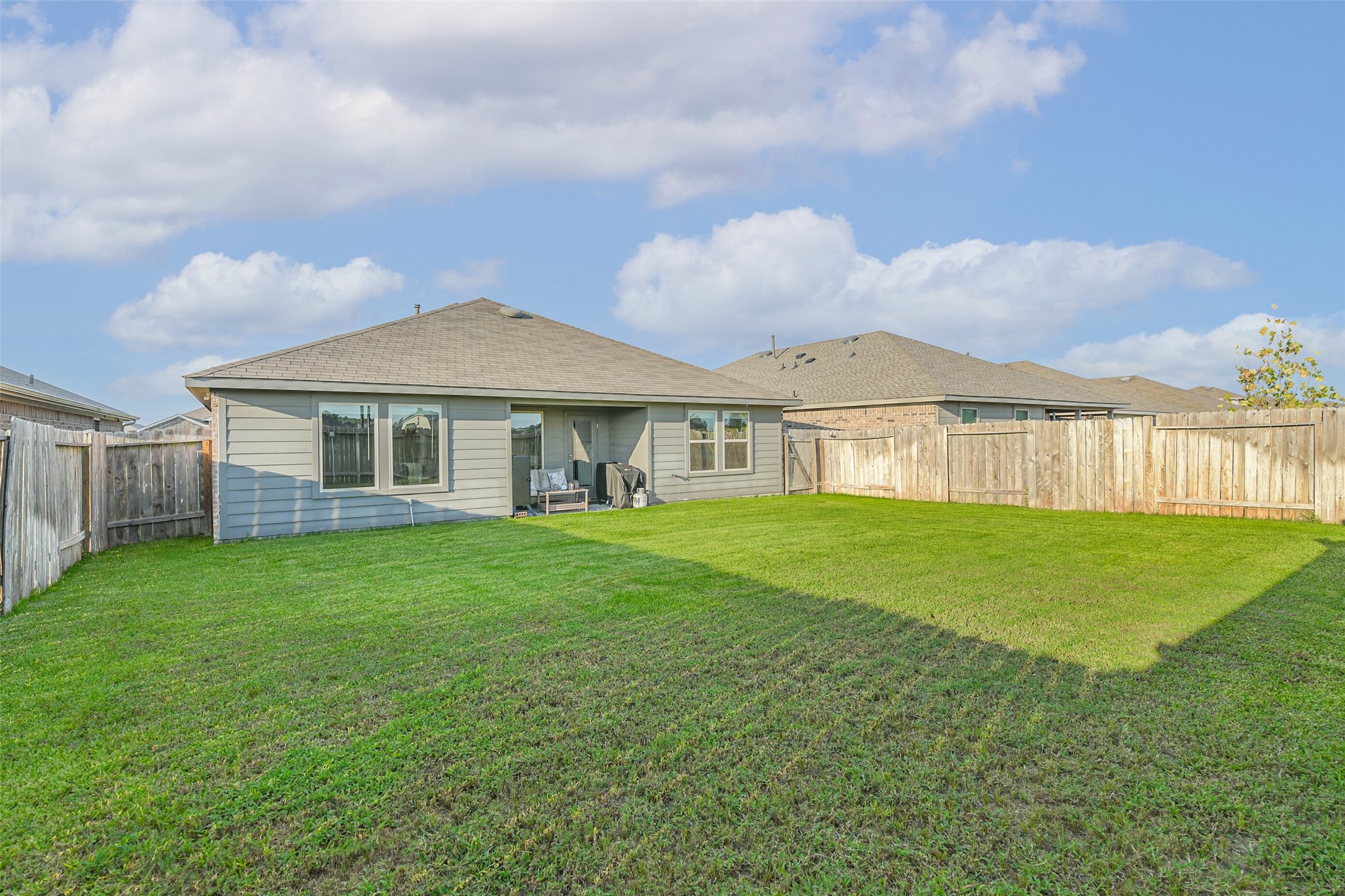 20342 Green Mountain Drive New Caney, TX 77357 - Photo 27 of 30 a front view of a house with a garden